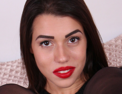 Petra's Sensual Nylon Feet Tease in Bedroom - Image 2