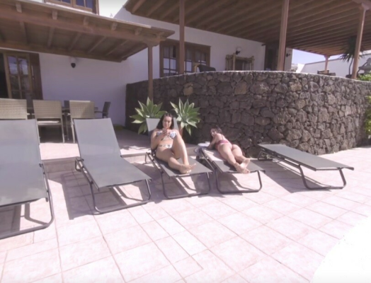 Maya and Zara in Steamy Poolside Relaxation - Image 1