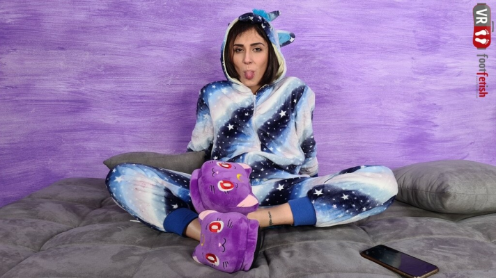 Stunning Aradia In A One-Piece Hooded Pajama And Purple Slippers - Image 1